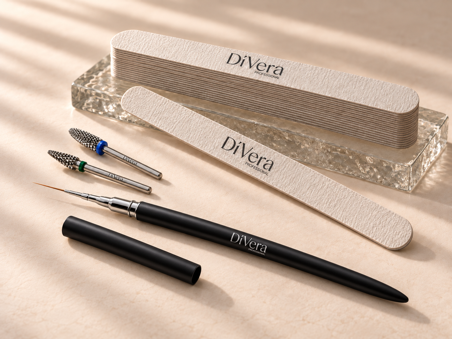 DiVera thin nail files, precision drill bits and a black liner brush on ivory stone